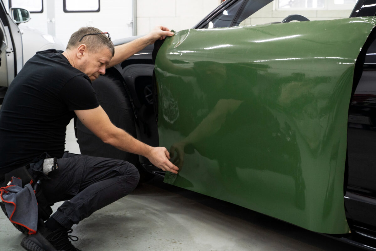 Man busy to personalize his car exterior