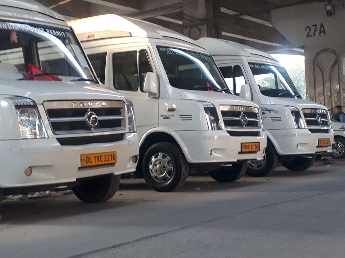 Eco-Friendly Travel in a 9-Seater Luxury Tempo Traveller