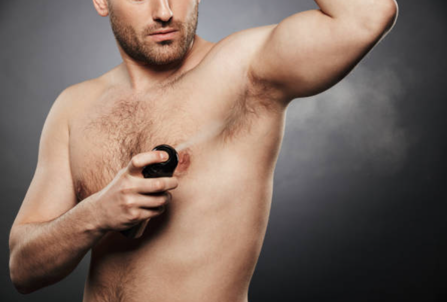 applying best hair removal spray