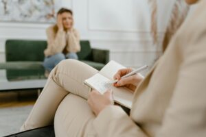 Therapist helping client manage rumination through guided therapy session in Austin.